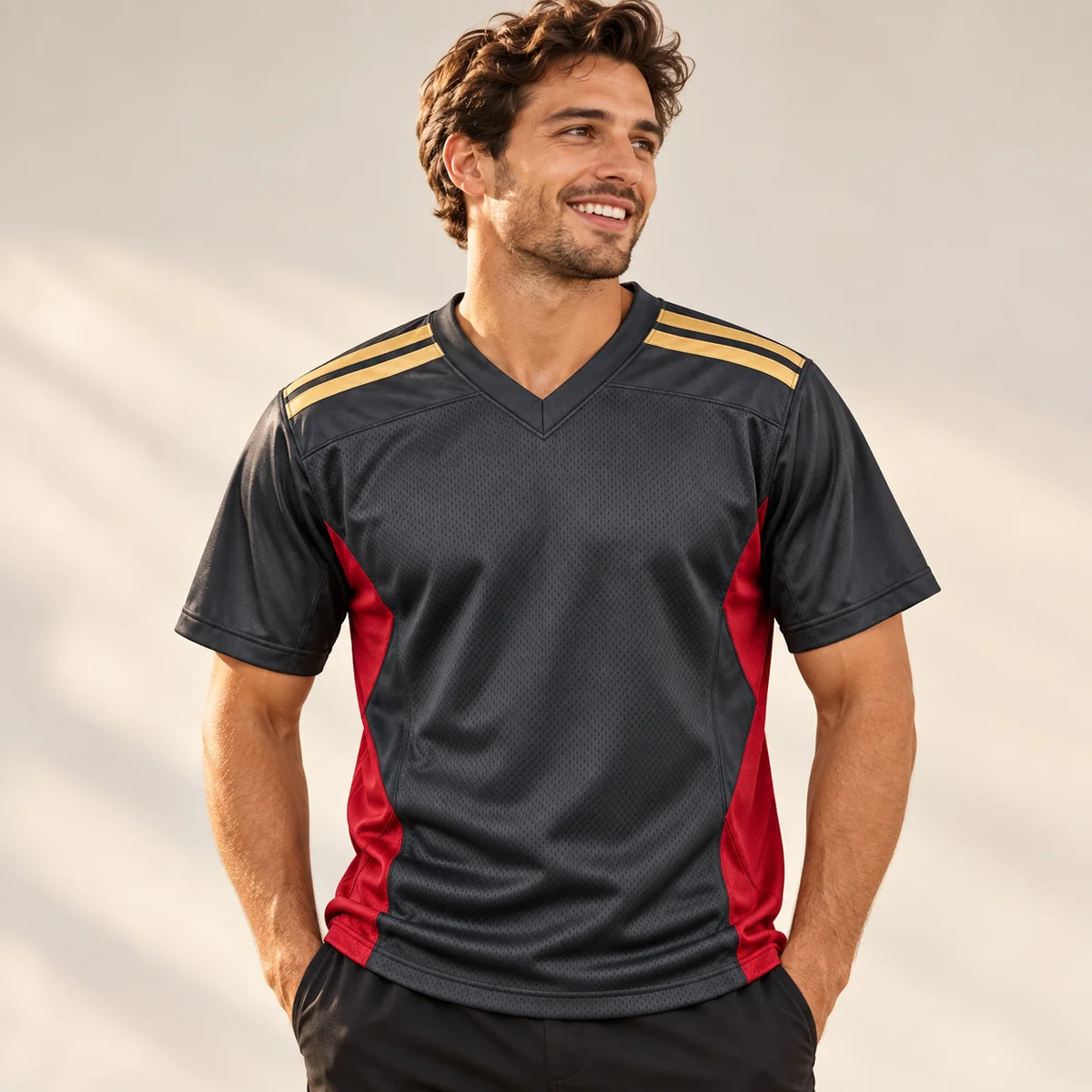 Lifestyle mockup of a graphite football jersey in the Graphite Goal Line design