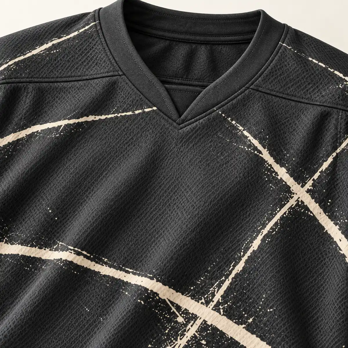 Detail mockup of a graphite hockey jersey in the Graphite Frost Line design